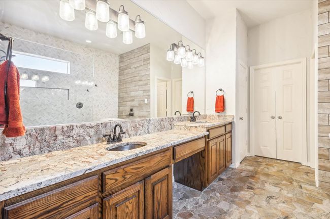 Primary Bathroom remodeled in 2021 featuring double sink vanity and tile patterned floors | Image 14