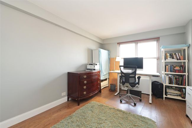 Office featuring wood finished floors and baseboards | Image 10