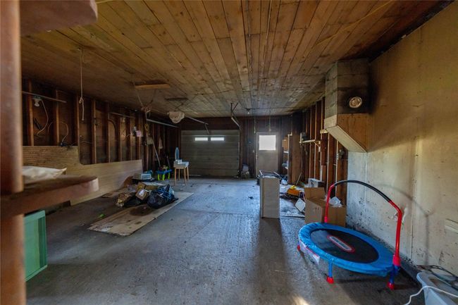 Miscellaneous room featuring a garage and wood ceiling | Image 33