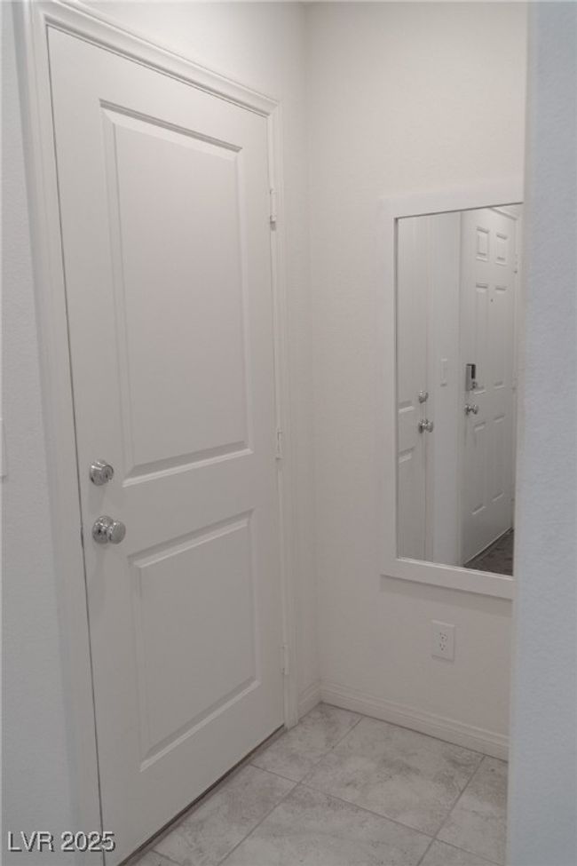 Doorway with baseboards and marble finish floor | Image 14