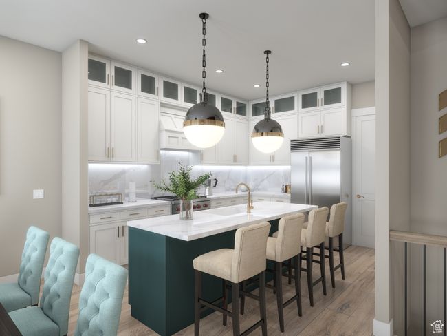 Kitchen with white cabinets, tasteful backsplash, wood-type flooring, premium range hood, and a kitchen island with sink | Image 7