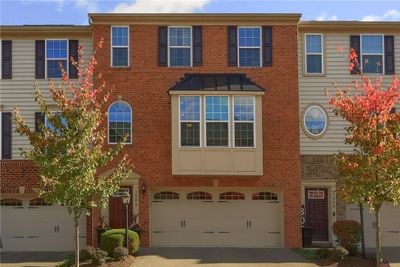 Front of townhouse with plenty of parking for guests just down the street | Image 1