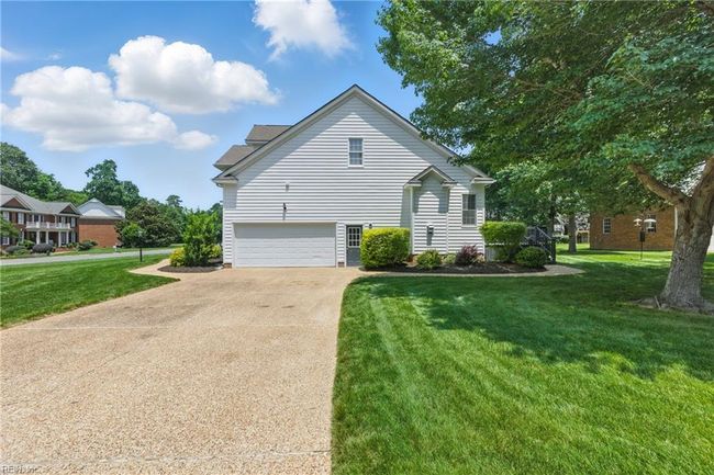 Right exterior showing side-loading 2 car garage and expanded driveway for ample off-street parking... | Image 35