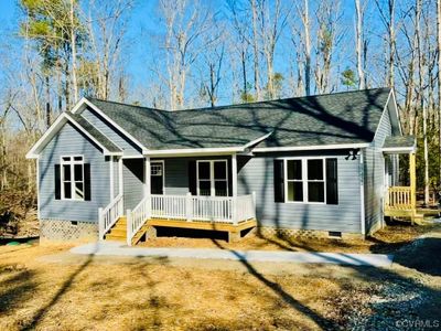 Picture is a previously built home by the same company and an example of the front elevation. The brick accent wall is not included. | Image 1