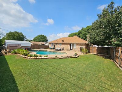 View of yard featuring a fenced in pool | Image 3