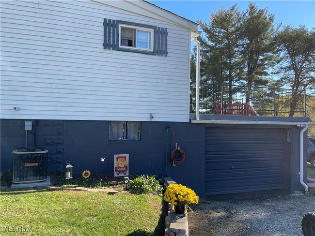 View of side of home with a yard and central AC unit | Image 4