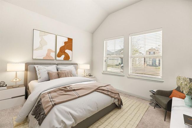 Secondary bedroom features plush carpet, custom paint, and a large window with privacy blinds. *Virtually Staged | Image 15