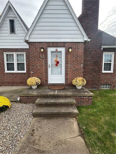 View of "welcoming" front entry with tastefully decorated yard | Image 3