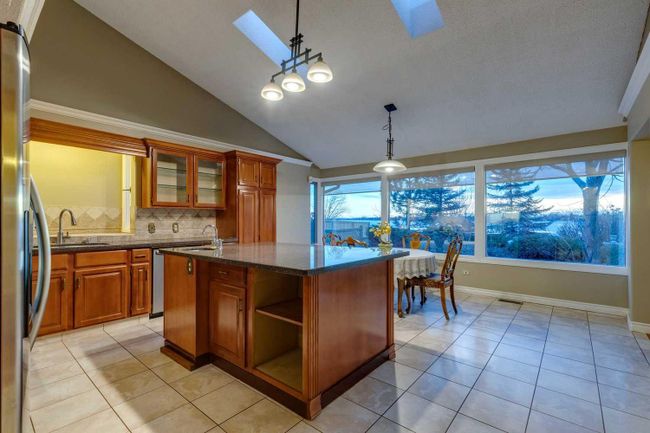 305 East Chestermere Drive, Home with 4 bedrooms, 2 bathrooms and 6 parking in Chestermere AB | Image 4
