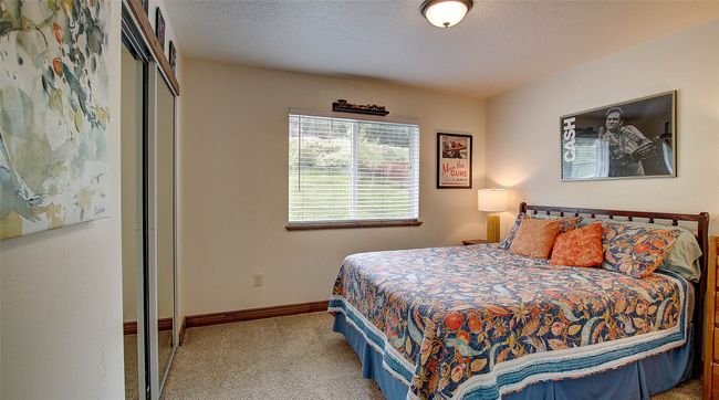 Bedroom featuring carpet flooring, a closet, and baseboards | Image 28