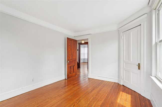 Unfurnished bedroom featuring light wood-type flooring and baseboards | Image 18