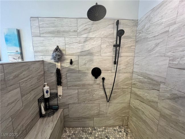 Full bathroom featuring a tile shower | Image 38