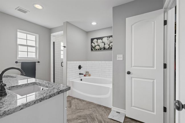 Bathroom featuring a bath, a stall shower, baseboards, vanity, and recessed lighting | Image 20