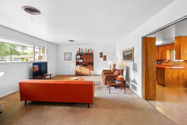 Living room with light colored carpet, baseboards | Image 10