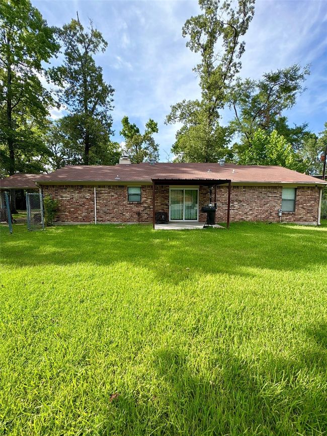 Back of the property with entertaining space | Image 7