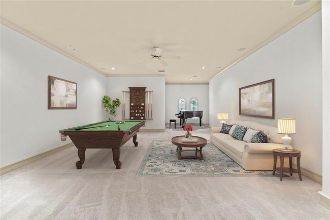 Expansive upstairs gameroom w/crown molding, ceiling fan, recently installed carpet - virtually staged for your designing ideas. | Image 29