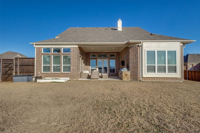 Rear view of house featuring a yard and a patio area | Image 35