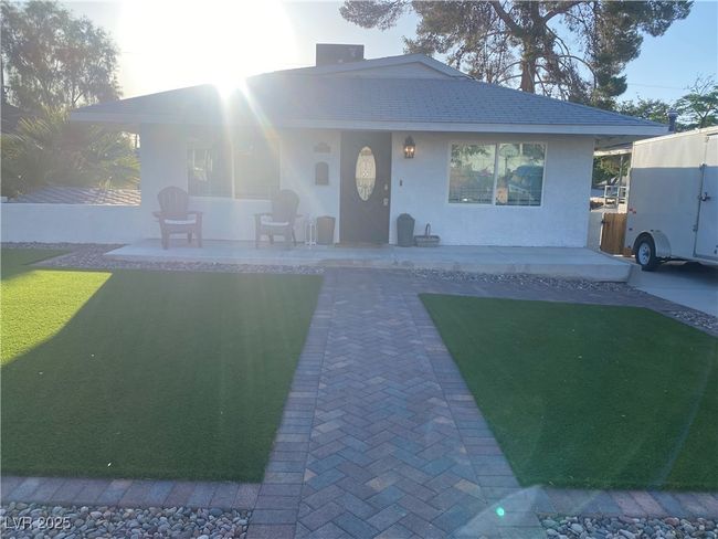View of front of house featuring stucco siding and a patio | Image 28