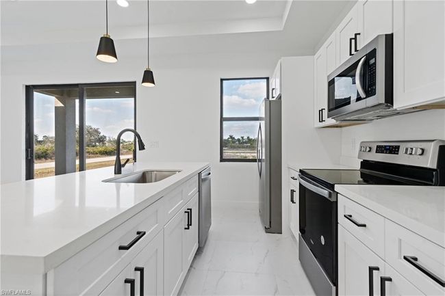 3129 71 St St W, House other with 3 bedrooms, 2 bathrooms and 2 parking in LEHIGH ACRES FL | Image 5