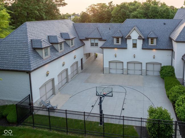 view of front facade with concrete driveway, a garage, and stucco siding | Image 108