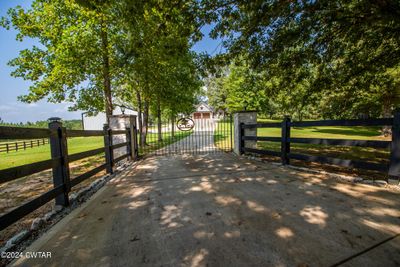 Front Entrance from Road, gate opens to 92 acres fenced & cross fenced, 5 BR, +2900 Htd Sq. ft. | Image 1