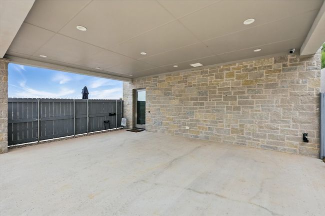 View of patio / terrace with fence and an attached carport | Image 14