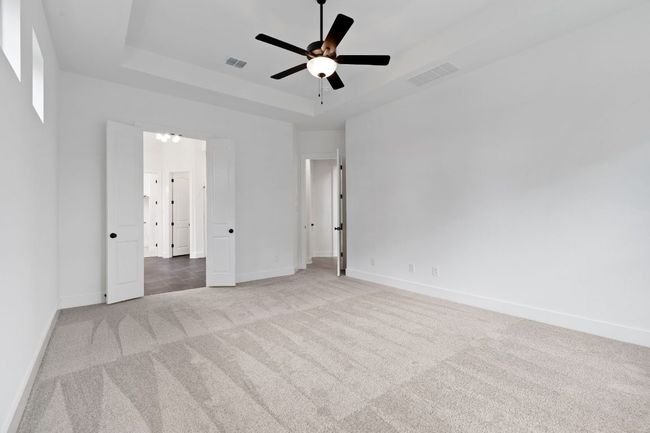 Primary Bedroom with tray ceiling | Image 21
