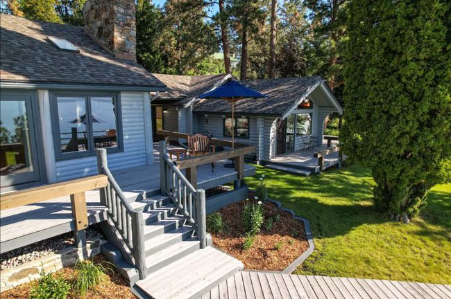 View of front of house with a wooden deck and a front yard | Image 52