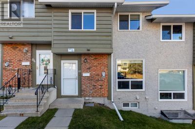 6915 Ranchview Dr Nw, Townhouse with 4 bedrooms, 3 bathrooms and 1 parking in Calgary AB | Image 1