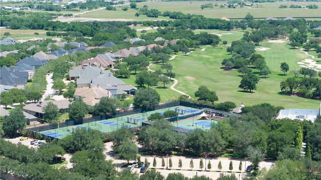Aerial view of property's location featuring a golf course and nearby suburban area | Image 49