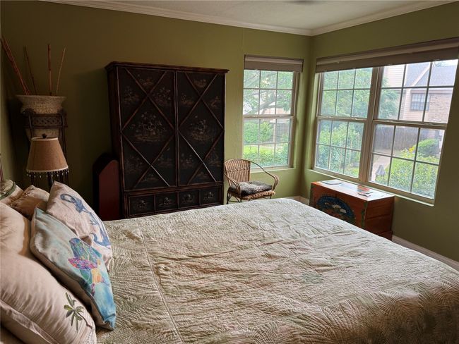 Bedroom featuring ornamental molding and baseboards | Image 7