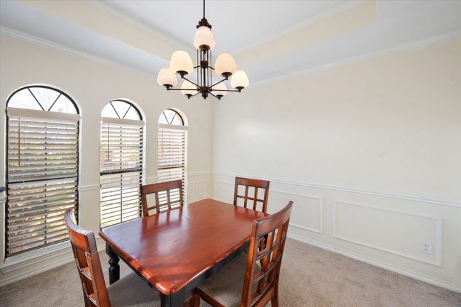 Separate dining room has large windows! | Image 11