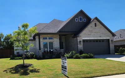 Craftsman style one story with stone accents and covered front porch. | Image 3