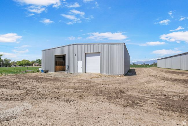 View of outdoor structure featuring an outbuilding | Image 23