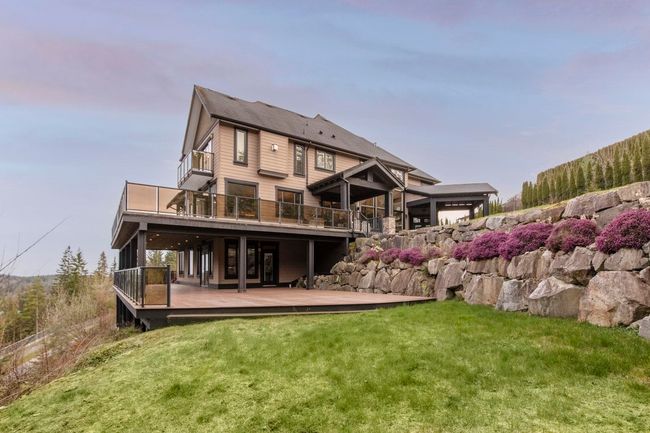 Rear view of property with a wooden deck and a yard | Image 38