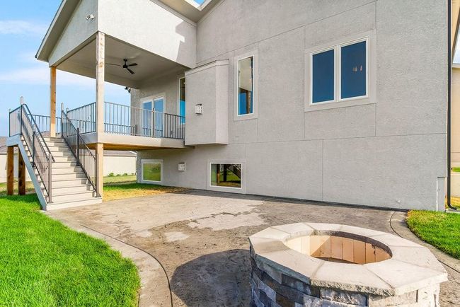 Option to do a patio to match this if preferred with stamped concrete and firepit. Photos of previous model home. Not actual listing. Features and sizes may vary. Contact agent for details & showings! | Image 28