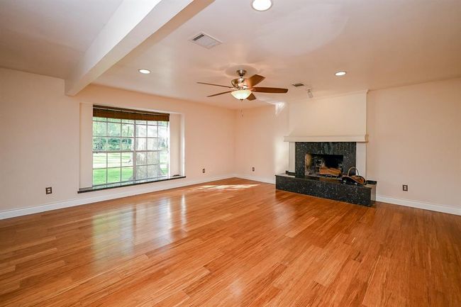 Enjoy the cozy, wood burning fireplace in the family room during the cold winter months! | Image 15