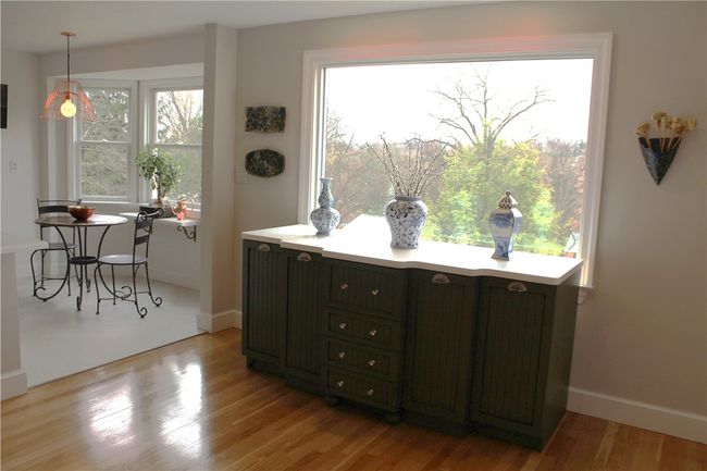 This Extremely Large picture window allows the natural light to flow through the Dining/Seating Area | Image 20