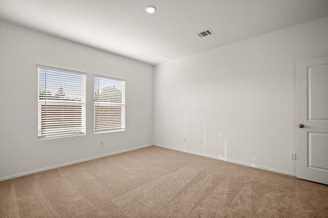 Unfurnished room with carpet, visible vents, and baseboards | Image 13