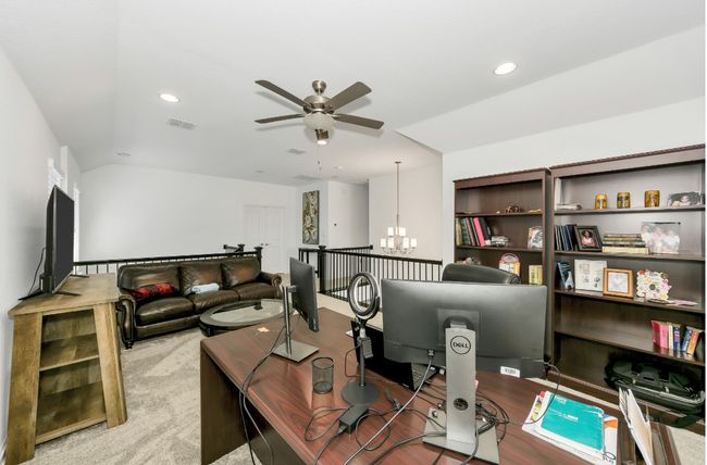 Office space featuring recessed lighting, visible vents, and ceiling fan with notable chandelier | Image 21