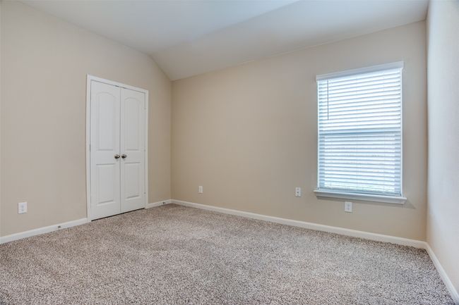 Unfurnished room featuring baseboards, carpet floors, and a wealth of natural light | Image 9