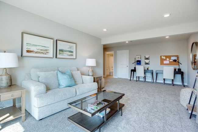 Another view of the spacious lower level rec room. Photo of model home, colors and selections shown may vary | Image 15