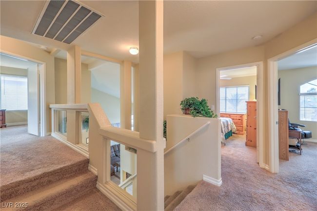 Hall with carpet flooring | Image 16