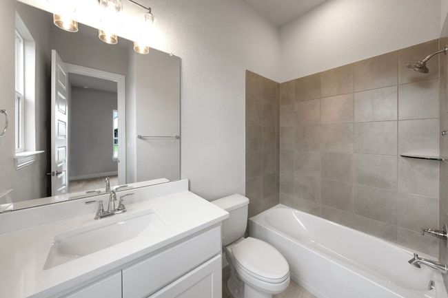 Full bathroom featuring vanity and shower / tub combination | Image 19