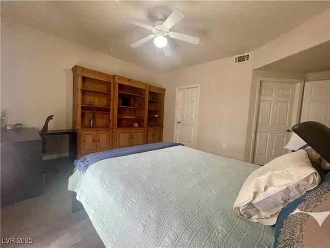 Bedroom featuring a ceiling fan and visible vents | Image 29