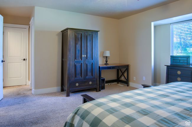 Carpeted bedroom featuring baseboards | Image 14