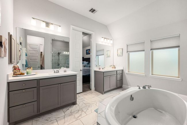 This additional view of the primary bath showcases two sets for your sink and additional counter space. | Image 12