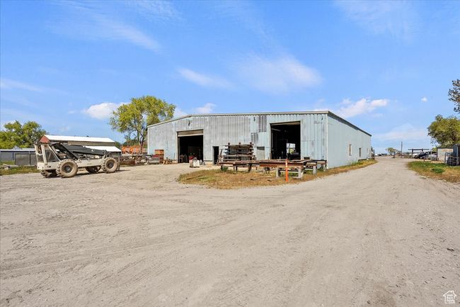 View of pole building featuring driveway | Image 11