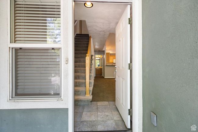 View of exterior entry with stucco siding | Image 5