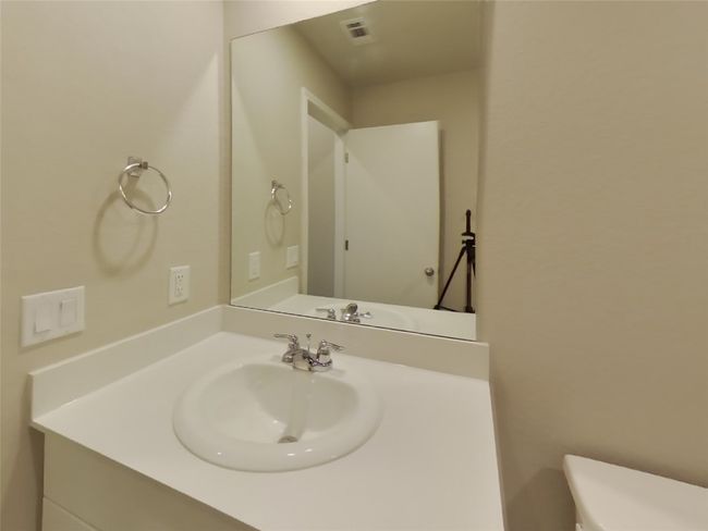 Half bathroom featuring toilet and vanity | Image 14